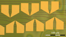 Microscope image of the fabricated device with splits for various microring-waveguide coupling distances.